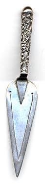This bookmark, shaped like a trowel, is unmarked but tested to be 800 silver. It is English and was made circa 1900.