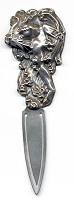 This bookmark is a William B. Kerr & Co. piece. It has the American Beauty mark and is stamped 923, probably a catalog number. It was made around the turn of the 20th century.
