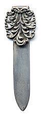 This bookmark is made in the US by H.H. Curtis & Co. between 1891 and 1915. It is marked with the makers mark, Sterling and 704. The top is an art nouveau design.
