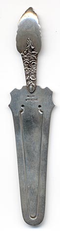 This bookmark is American made by Wendell Manufacturing Company. It is marked with the manufacturers hallmark, Sterling and the number 605. The top portion of the bookmark is probably one of their flatware patterns. The date is 1885 - 1900.
