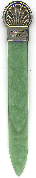 This bookmark is made of two pieces of green celluloid clipped together with a silver plated mount in the shape of a scallop. It is marked EPNS (Electro Plated Nickel Silver) and has a Patent number 212101. It was patented on March 2, 1923 by A. J. Smith of Variety Works, Fredrick Street, Birmingham, England. 
