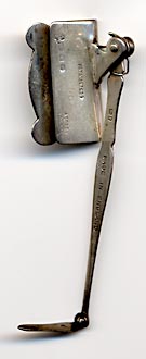 This bookmark was made in London by Asprey. It is a very unusual piece that is made with a clip and a spring. It clips over the front or back book board and the arm keeps the page open. It is marked Pat. No. 257529 in the center of the clip. On the bottom of the clip is the manufacturers mark A & Co., Ltd., the lion and the mark for London and the date mark C indicating the year 1938. In the lower right hand corner is marked Asprey London. The arm has the lion and the mark for London and the words "Made in England". 