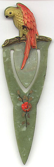 This bookmark is some sort of plastic either celluloid or bakelite. It has a parrot on top and a flower in the middle. The dealer said it came from Wisconsin in the 1940's.