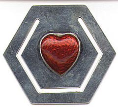 This bookmark is not that old. It's probably from the 1960's - 1970's. It is marked Tiffany and Co Sterling on the back. The front has a red enamel heart.