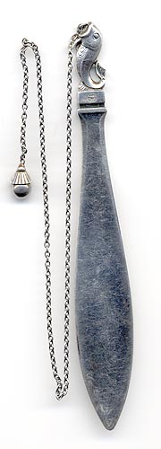 This bookmark was made in Denmark by Georg Jensen sometime after 1945. It is a fish hooked to a chain. The other end of the chainis a ball. This can also be seen in the new 1997 book on Georg Jensen silver.