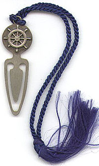 This bookmark has a blue tassel and a ship's wheel design at the top. It is marked Inman Sterling on the back. I don't know when it was manufactured.