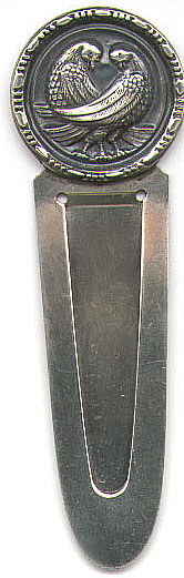 This bookmark has a design of two doves crossing each other within a round frame. It is marked Sterling "by Duchin" on the back. The date of this bookmark is unknown.