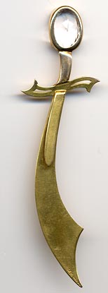 This bookmark was made in the US. It is 14K gold with a lead crystal on top and an opal underneath. It is marked 14K R. Schaezlein. The top blade is finely scribed with an intricate design having a crescent moon and a star. 