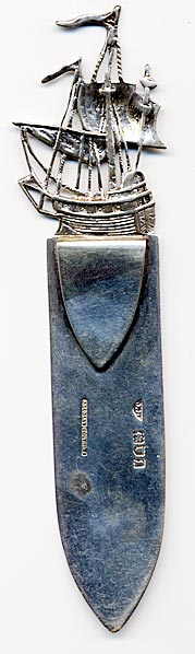 This bookmark was made in London, England in 1906. It is marked J.D. with the English marks for the place and date. It is also marked J. Dudley Southsea. It is a large and solid mark with the top depicting a tall sailing ship.