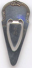 This bookmark is American made. It is marked S. Kirk & Son Sterling and the number 8. I can't be sure of the manufactured date. I have two of these bookmarks and one is solid in back and the other is indented and the pattern can be seen from the back. I guess the solid one is older.