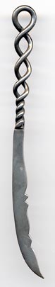 This bookmark was made in the US by an unknown manufacturer. It is only marked sterling on the back blade. It is in the shape of a knife or sword with a twisted wire top. The date is 1900 - 1910. 