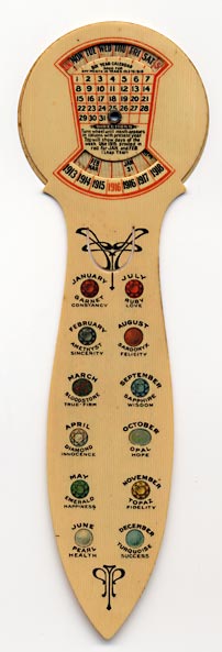 This bookmark was made in the US by The American Art Works, of Coshocton, Ohio. It is a celluloid advertising bookmark for Brantley-Draughon Business College and is a six year calendar for the years 1913 - 1918 with a rotaing dial in the back. The instructions read "Turn wheel until month appears in column with present year. Top will show days of the week. Use 1916 printed in red for JAN. and FEB (Leap Year)." The front blade has the birth stones for each month. The back reads, "Every national bank in Fort Worth Represented on our directory board. Brantley-Draughon Business College, 6th and Main Sts., Fort Worth, Texas. Phone Lamar 1307. Bookkeeping - Shorthand - Telegraphy."