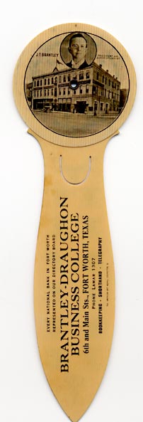 This bookmark was made in the US by The American Art Works, of Coshocton, Ohio. It is a celluloid advertising bookmark for Brantley-Draughon Business College and is a six year calendar for the years 1913 - 1918 with a rotaing dial in the back. The instructions read "Turn wheel until month appears in column with present year. Top will show days of the week. Use 1916 printed in red for JAN. and FEB (Leap Year)." The front blade has the birth stones for each month. The back reads, "Every national bank in Fort Worth Represented on our directory board. Brantley-Draughon Business College, 6th and Main Sts., Fort Worth, Texas. Phone Lamar 1307. Bookkeeping - Shorthand - Telegraphy."