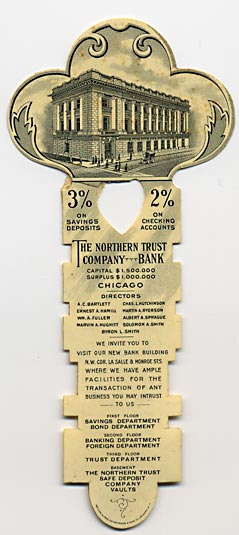  This bookmark was made in the US by the Whitehead and Hoag Company of Newark NJ.  It is a celluloid advertising bookmark for The Northern Trust Company of Chicago. The top has a picture of the bank building and the blade has information about the bank and the interest rates for savings and checking accounts. The back has a calendar for the year 1907. The bookmark is shaped like a key. 