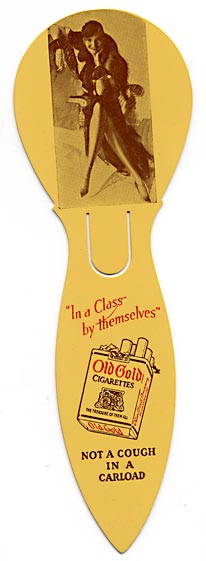 This bookmark was made in the US between 1910 - 1920. It is a celluloid advertising bookmark for "Old Gold" cigarettes. It has a photo of a woman sitting in a chair with her legs crossed and a cigarette in her hand. The advertisement says "In a Class by themselves. Not a cough in a carload." 
