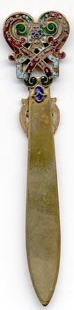  This bookmark was made in France between 1890 and 1900. It is a very decorative brass and Champleve enamel piece.  