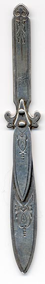 This bookmark was made in the US by Gorham. It is marked with the manufacturers hallmark and Sterling. It is in the shape of a knife with hand chasing all over. It was also used as a letter opener. The date is 1875 - 1890.
