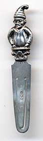 This bookmark is made in Birmingham, England in 1927 as specified in the hallmarks on the blade. The top is a figural of "Punch" the clown.