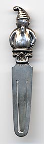 This bookmark is made in Birmingham, England in 1927 as specified in the hallmarks on the blade. The top is a figural of "Punch" the clown.