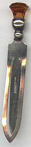 This bookmark is from Birmingham, England dated 1924 by the date hallmark. The manufacturer hallmark is ALL for Adie and Lovekin. It is a citrine stone in a thistle.