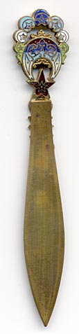 This bookmark was made in France by an unknown manufacturer. It is a colorful enamel and brass cloisonne piece know as Battersea. The date is 1900 - 1910.