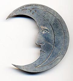  This bookmark was made in London, England. It is marked with HSB, the manufacturer, the hallmarks for London and the year 1889, and Houghton & Gunn 162 New Bond St. W. It is a figural Man in the Moon with a face on both sides.   