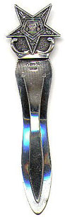 This bookmark was made in Holland. It is marked HH 90 and Holland. The top part of this bookmark is the Eastern Star, the symbol of the woman's branch of the Freemasons.