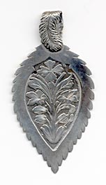  This bookmark was made in the US by D.S. Spaulding of Mansfield, Massachusetts. It is marked sterling with the makers hallmark on the back. It is a beautiful piece in the shape of a leaf. The top has a feather folded over. The top blade has a flower design. The date is 1900 - 1910.   