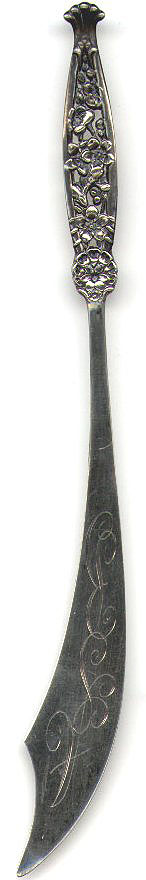 This bookmark (actually it is a letter opener) is American made by Whiting Manufacturing Company and is marked with the makers hallmark.   The top handle is finely detailed leaves and flowers. 