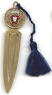 This bookmark was made in Portugal. It is either gold plated or gold washed over silver. It has enamel and gold filigree work on the top. Date of manufacture is unknown.