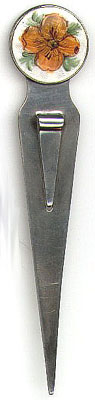 This bookmark is American made and is only marked Sterling. It has an enamel picture of a flower at the top. Date is probably early 1900's.