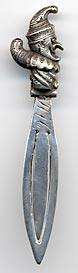  This bookmark is made in Birmingham, England in 1927 as specified in the hallmarks on the blade. The top is a figural of "Punch" the clown.  The date is 1927.  