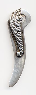 This bookmark is made in the US by an unknown manufacturer for Tiffany and Co. It is marked Sterling and Tiffany and Co. The top blade is an art nouveau leaf design. 