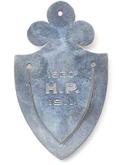 This bookmark was made in the US by Black, Starr & Frost and is marked as such with their hallmark of eagle with spread wings. The bookmark is in the shape of a spade and is inscribed 1830 H.P. 1911. This is possibly masonic. The date is 1911.
