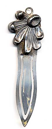 This bookmark was made in the US by an unknown manufacturer. It is marked 925/1000 sterling. The top is a figure of a partial flower with some petals missing (on purpose).  The date is 1900 - 1910.