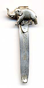 This bookmark was made in the US by an unknown manufacturer. It is marked sterling. The top is a figural elephant, walking with trunk upturned.  The date is 1930 - 1950.