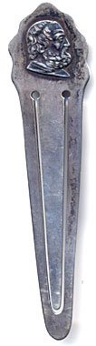This bookmark was made in the US by Parks Bros. & Rogers. It is marked with the manufacturers hallmark surrounded by the word sterling. The top is the head of a bearded man, possibly a Roman philosopher. The date is 1900 - 1910. 