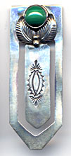 This bookmark is made in the US by a native American tribe. It has a green stone on the top and is marked Many goats, sterling on the back.