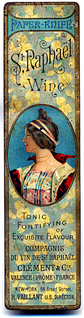 This bookmark was made in the US as an advertisement for St. Raphael wine. It is painted tin and has a picture of a woman in the center.