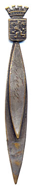 This bookmark was made in France. It has a lion passant in a shield with a crown on top.