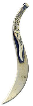 This bookmark is Middle-eastern in origin. It has a curvy shape with a flower inscribed on the top blade.