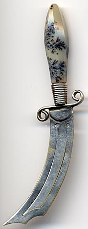 This bookmark, in the shape of a knife, has a quartz/agate handle and silver plated over brass blades. It is made in Scotland circa 1920 - 1930.