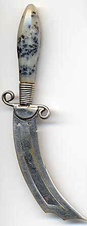 This bookmark, in the shape of a knife, has a quartz/agate handle and silver plated over brass blades. It is made in Scotland circa 1920 - 1930.