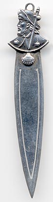 This bookmark was made in Spain and is marked Maside, which according to Wikipedia, is a municipality in Ourense (province) in the Galicia region of north-west Spain. The top is the head of a conquistador. The date is unknown.