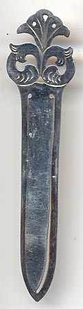 This bookmark was made in Sweden. It is has Swedish hallmarks for sterling and a date mark for 1931. The top has a flowery design.