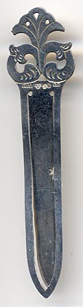 This bookmark was made in Sweden. It is has Swedish hallmarks for sterling and a date mark for 1931. The top has a flowery design.