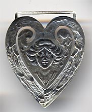 This bookmark was made in the US by Webster Co. It is only marked sterling. It is in the shape of a heart with a picture of a woman in the center. The date is 1913. 