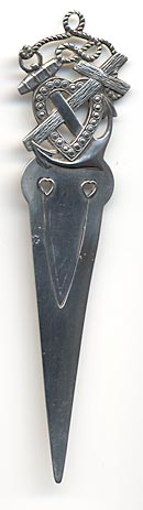 This bookmark was made in the US by Alvin Corp. It is marked with the makers mark on the back. The top is an anchor, heart and cross symbolizing faith, hope and charity.  