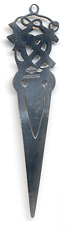 This bookmark was made in the US by Alvin Corp. It is marked with the makers mark on the back. The top is an anchor, heart and cross symbolizing faith, hope and charity.  