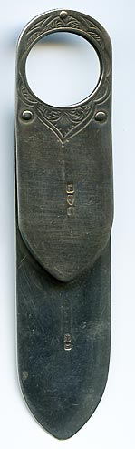 This bookmark was made in Chester, England in 1894 by Cornelius Saunders &amp; Francis Shepard. It probably had a magnifying glass at one time. This is almost identical to bookmark 1094 except for the material.